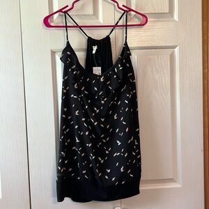 NWT Maurices black top with print and bottom band. 3X